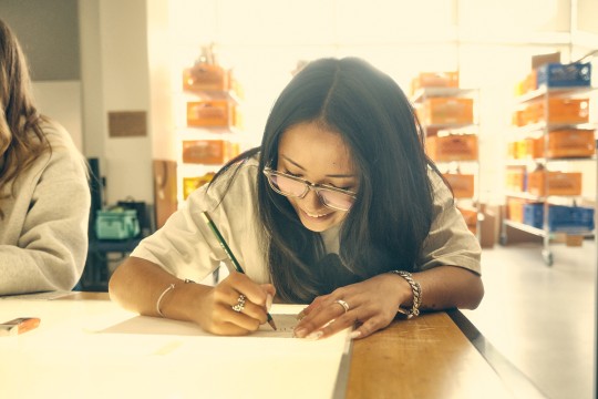 An RIT foundations students works during their 2D Design class.