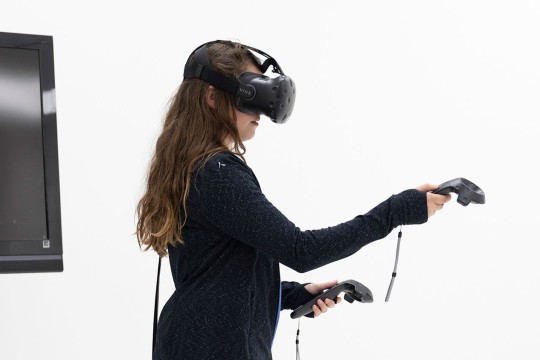 A person using a Vive V R headset.