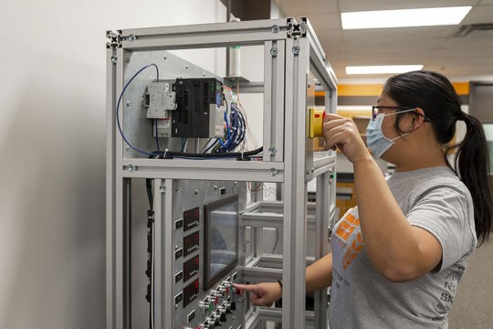 Student working with lab equipment.