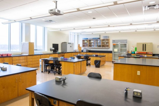 Classroom lab with six work tables.