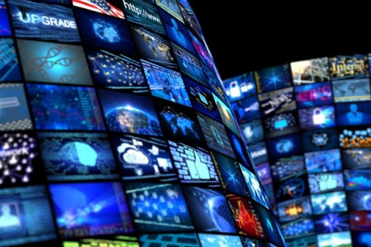 an image of lots of digital screens showing news and media and communication