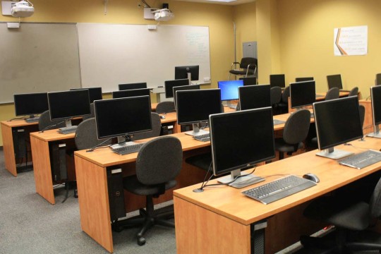 Computer lab with wooden desks