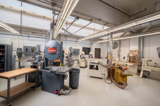 Fabrication room with bandsaws, drill presses, and other equipment