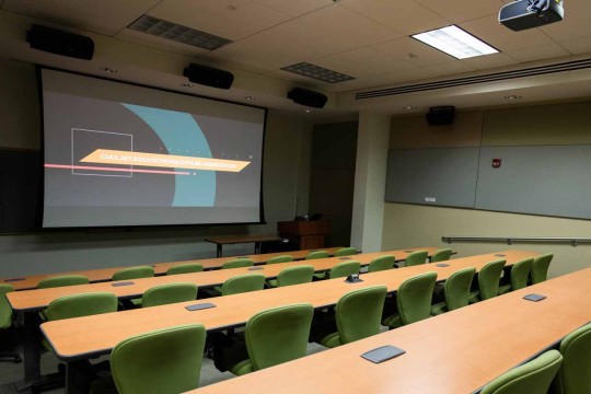 Stadium seating classroom with large projector screen