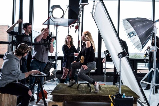 A group of people in a photoshoot.