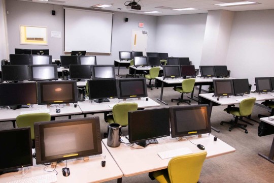 Interior view of the post-production lab, displaying the computers available for use.