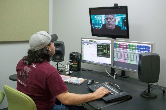 Student editing a video of Deadpool