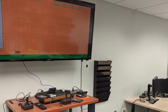 Lab with an Atari 2600 on a flat screen TV.