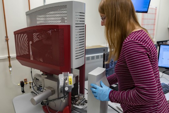 student working with equipment in imaging lab.