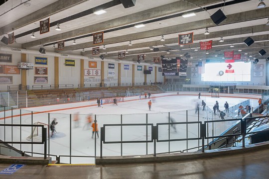 Students playing hockey.