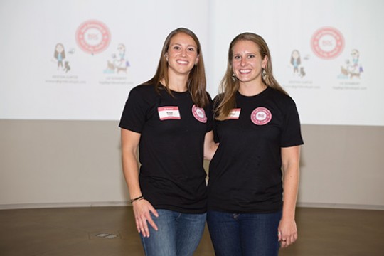 Two people posing for camera