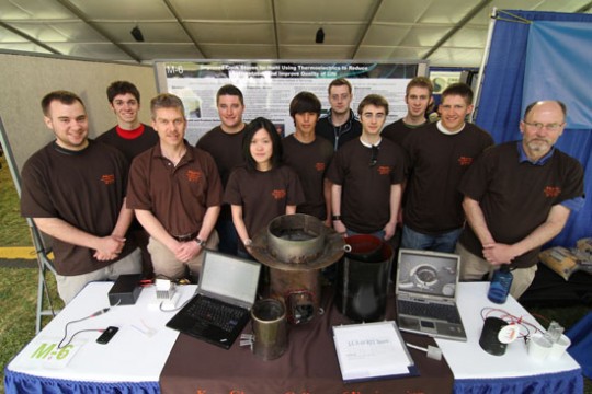 Team standing around product