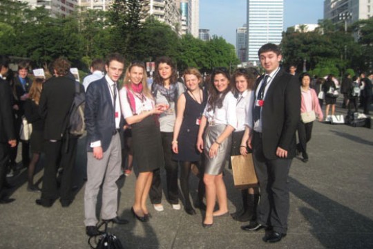 People posing for camera at event