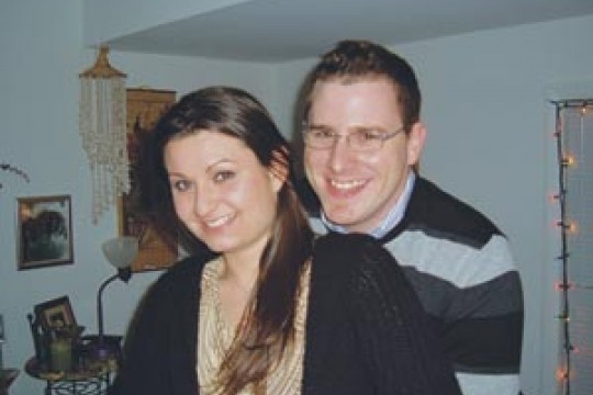 Two RIT alumni posing for camera