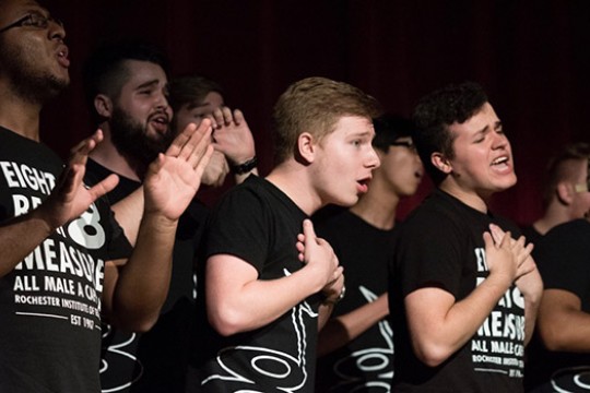 Group of singers performing on stage