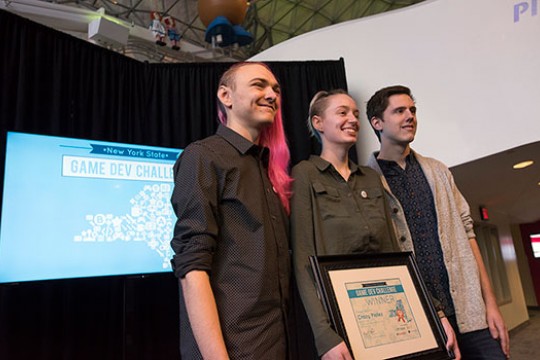 The RIT student team poses for a photo with their Game Dev Challenge first place certificate.