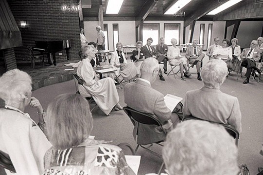People sitting in giant circle