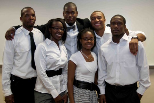 People posing for camera at event
