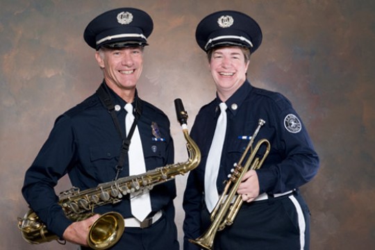 Two musicians posing for camera