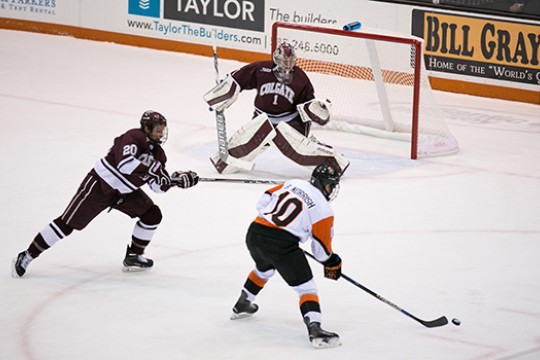 hockey player setting up a shot on goal.