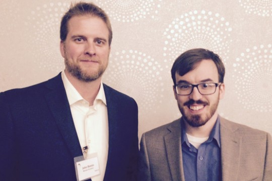 Two people posing for camera