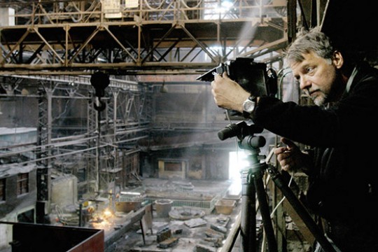 Person taking picture of abandoned building