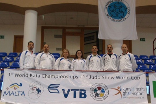 People standing behind banner at event