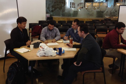 People working around table