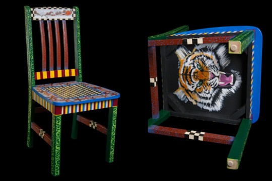 Picture of decorative chair with tiger painted on bottom