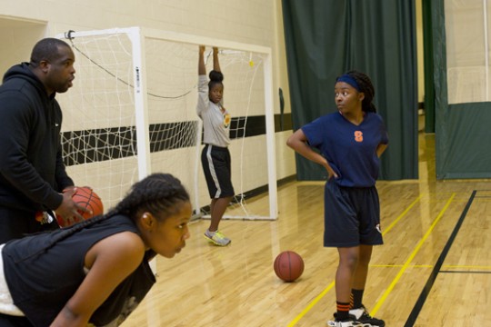 students playing basketball.