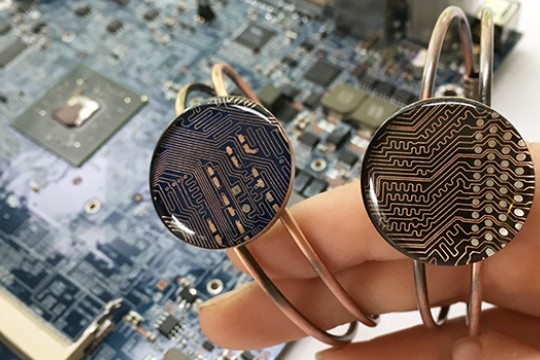 Person holding rings made of circuits
