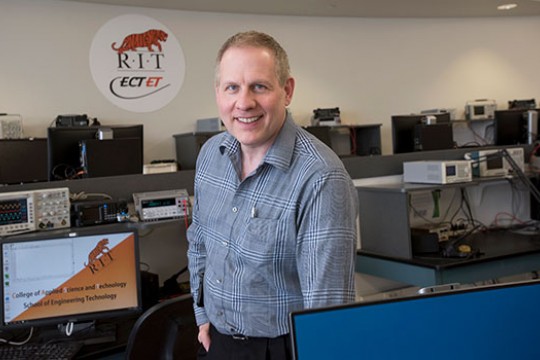 Steven Ciccarelli poses for a photo in one of the computer labs on campus.