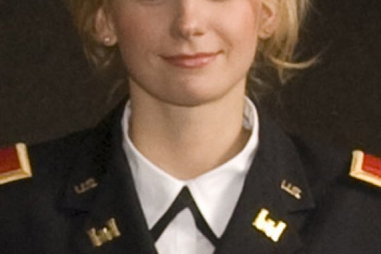 Person posing in uniform for camera