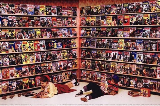 People reading in front of bookshelf