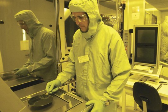 Researcher using machine