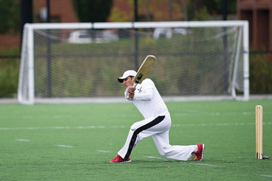 Person holding paddle on field