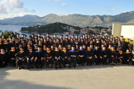Graduates gathered outside at graduation