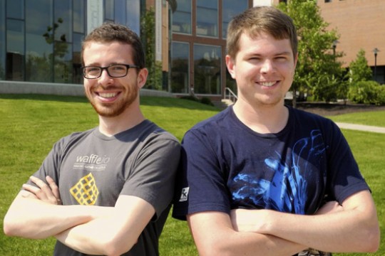 Two people posing for camera