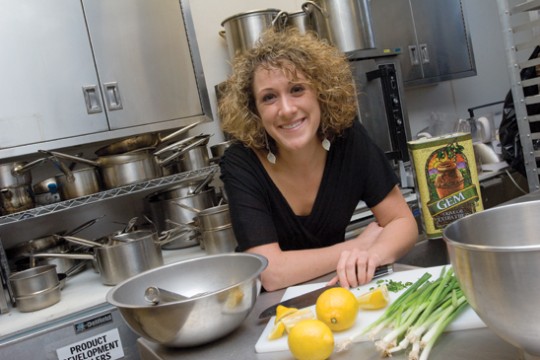 Person posing for a camera  in a kitchen