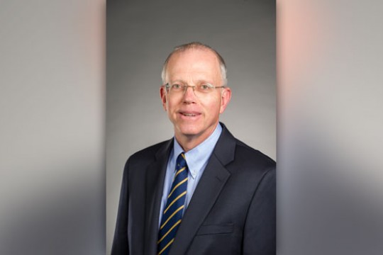 RIT president posing for camera