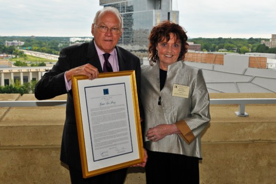 People posing with award