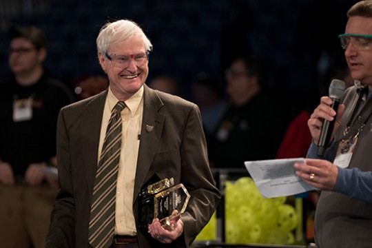 RIT President posing on field
