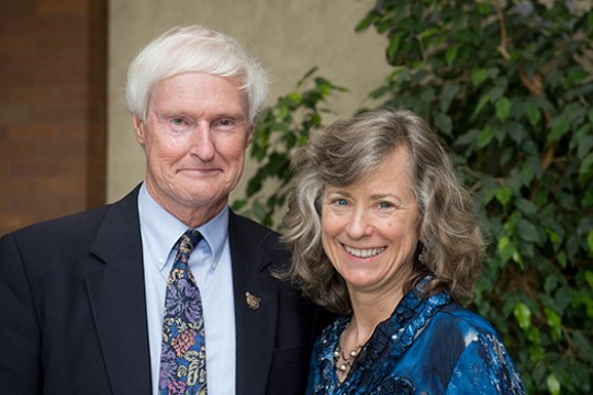 Two people posing for camera