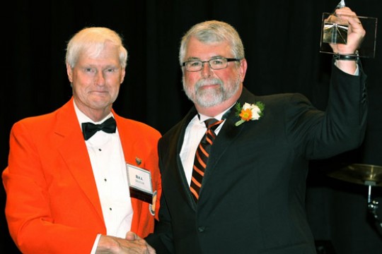 People accepting award on stage