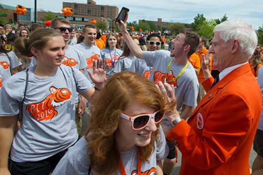 People gathered on pathway meeting RIT President