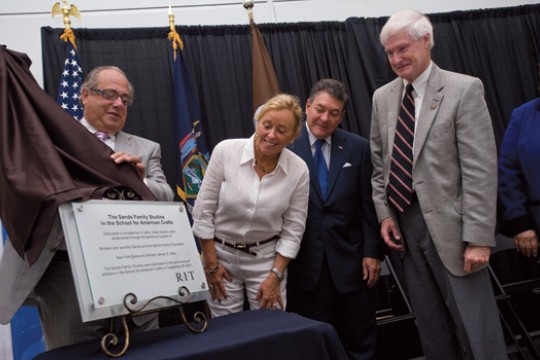 People looking at award