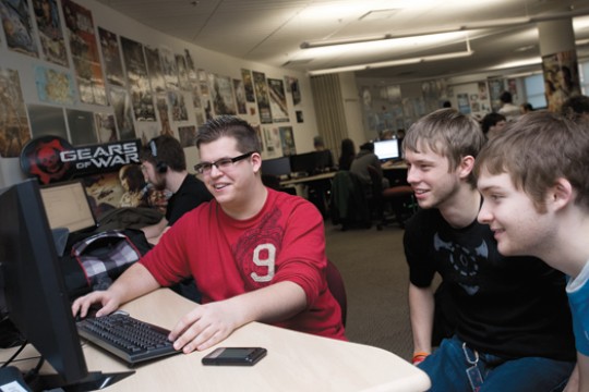 People gathered around computer