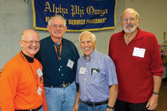 People posing at event