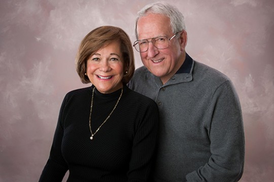 Two people posing for camera