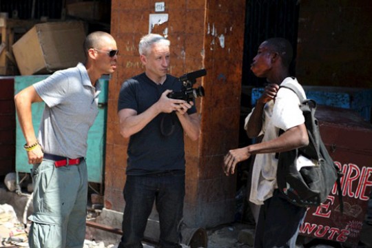 Three people talking outside